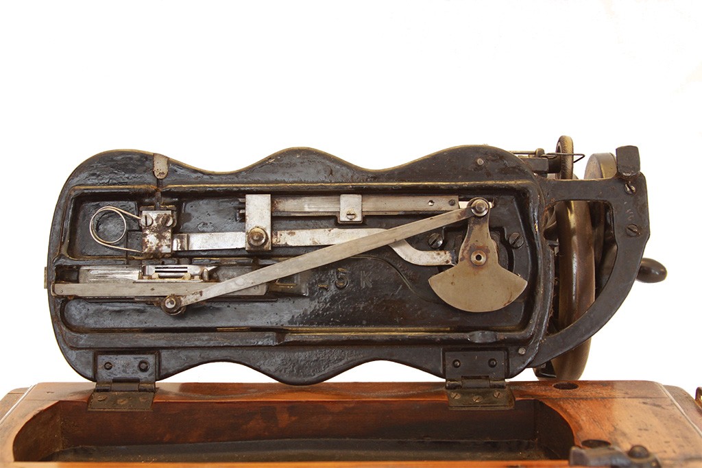 Compartment under the Singer Sewing Machine